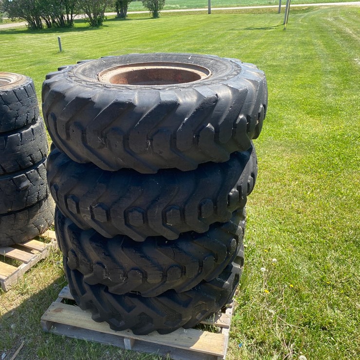 #7066 • (4) 14.00-20 Equipment Tires on Rims (Deerbrook, WI)