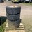 #7067-•-(4)-12-16.5-skid-steer-tires-on-rims-(deerbrook,-wi)-image-2