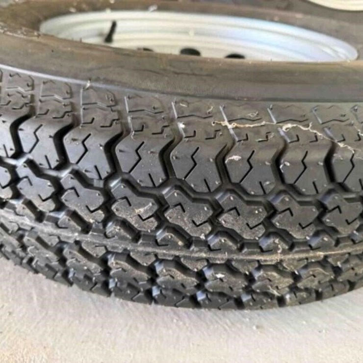 New 5-lug ST 205/75D14 trailer tire & wheel
