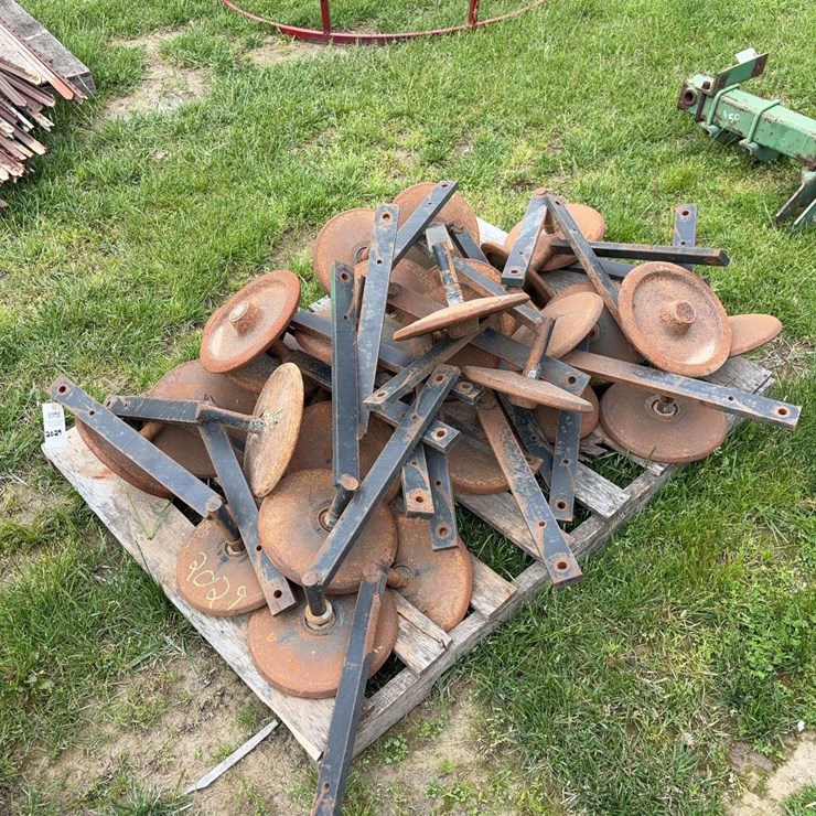 Pallet of steel closing wheels off JD 750 drill