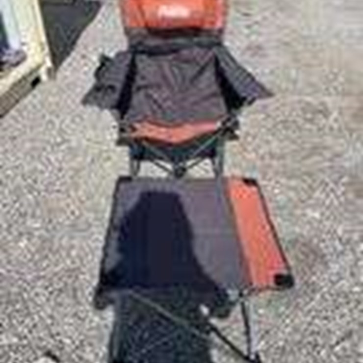 Collapsible camping chair. Orange-brown. Comes with foot stool and storage bag!