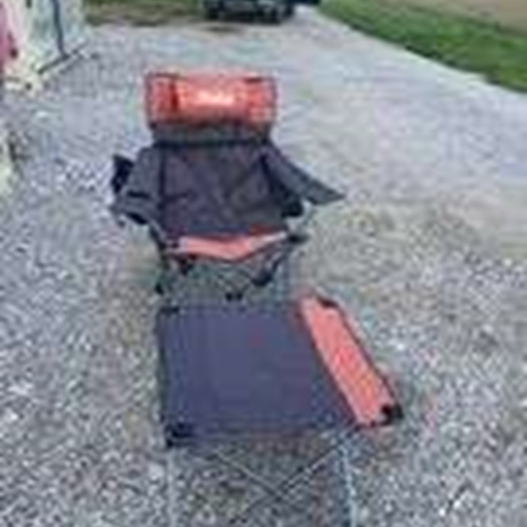 Collapsible camping chair. Orange-brown. Comes with foot stool and storage bag!