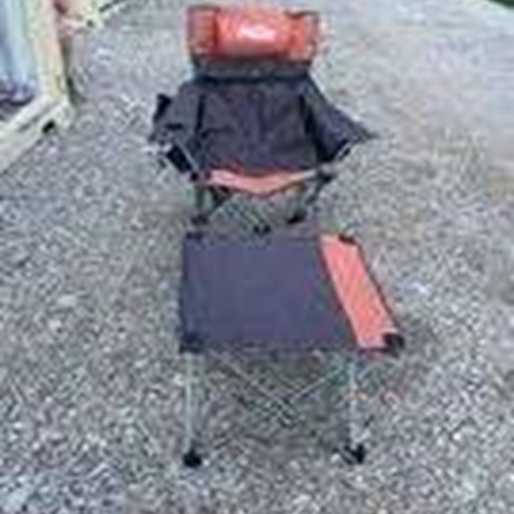 Collapsible camping chair. Orange-brown. Comes with foot stool and storage bag!