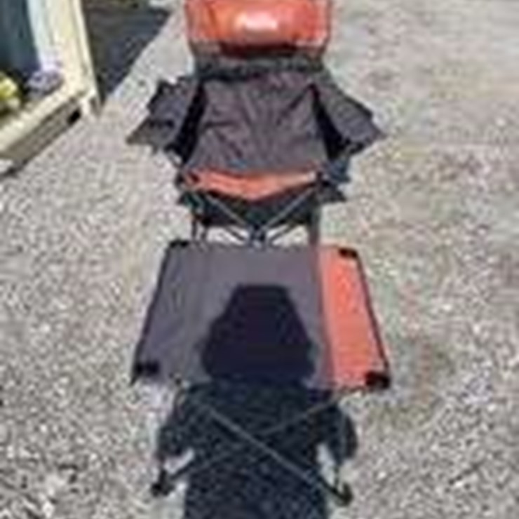 Collapsible camping chair. Orange-brown. Comes with foot stool and storage bag!