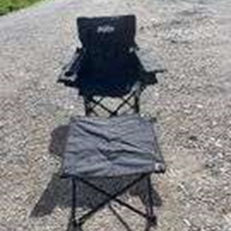 Collapsible camping chair. Black. Comes with foot stool and storage bag!