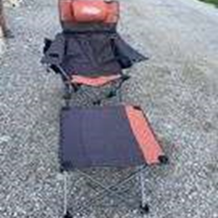 Collapsible camping chair. Orange-brown. Comes with foot stool and storage bag!