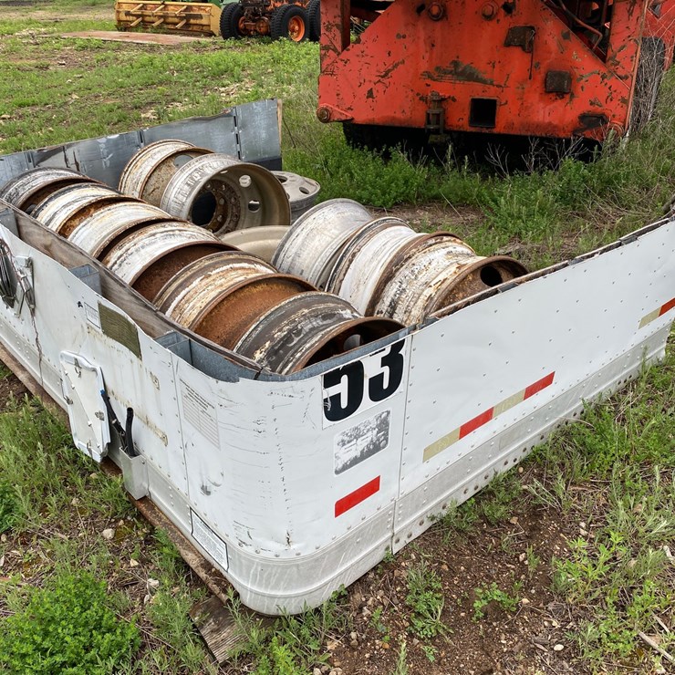 #1576 • (14) Semi Trailer Rims and Pile of Scrap Metal