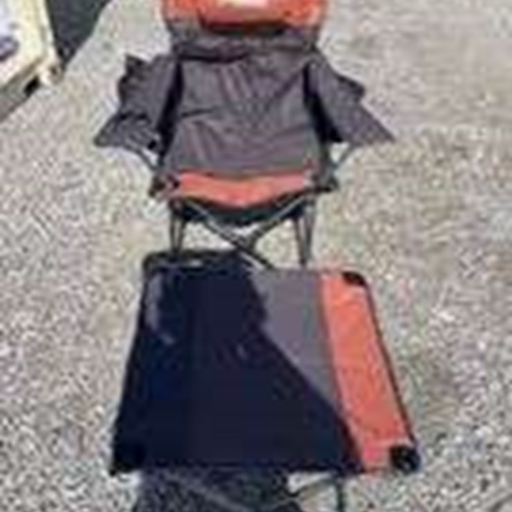 Collapsible camping chair. Orange-brown. Comes with foot stool and storage bag!
