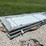 bundle-of-white-metal-roofing-panels-image-1