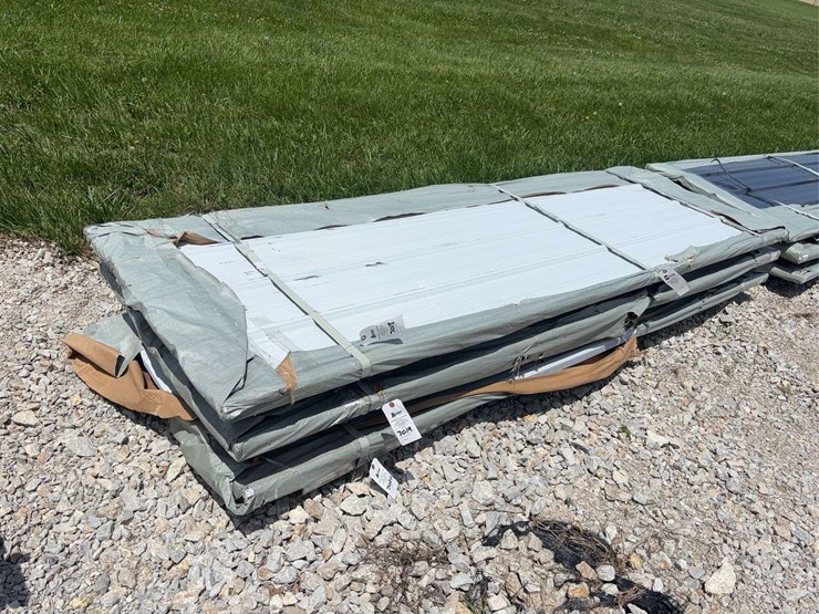 bundle-of-white-metal-roofing-panels-image-1
