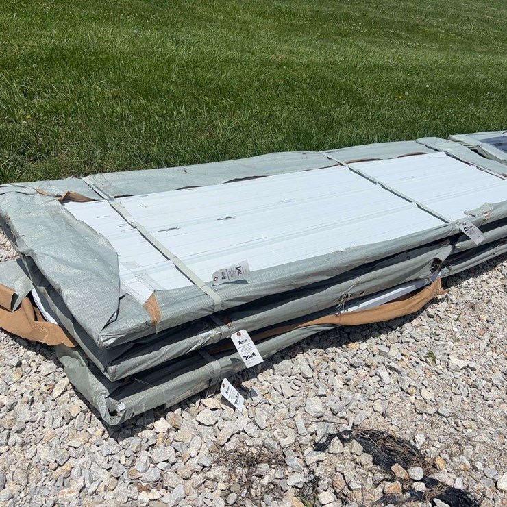 Bundle of White Metal Roofing Panels