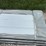bundle-of-white-metal-roofing-panels-image-6