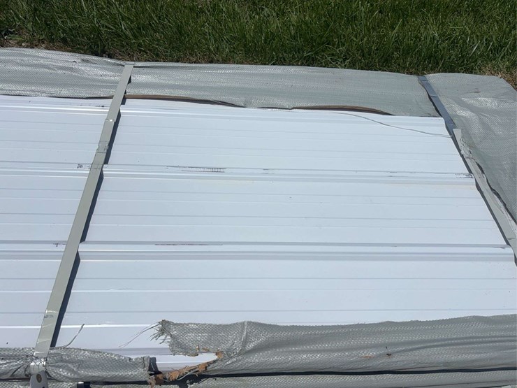 bundle-of-white-metal-roofing-panels-image-5
