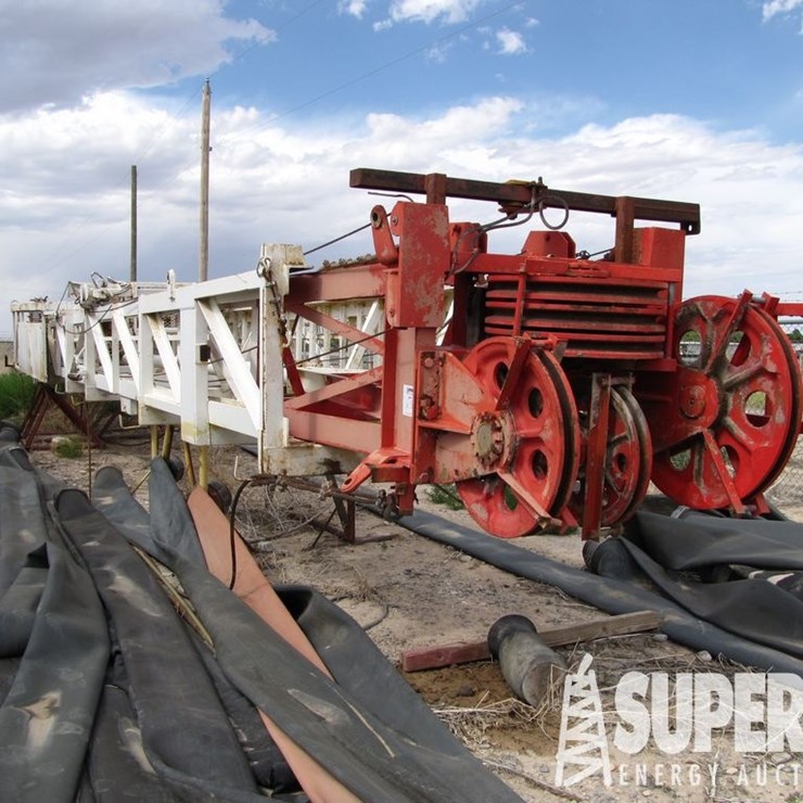 (6-52) SJ PETRO 105'H 265,000# Mast, w/ Rod & Tubi...