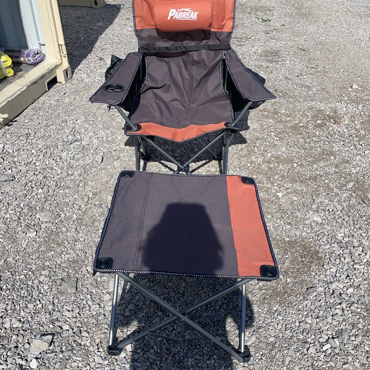 Collapsible camping chair. Orange-brown. Comes with foot stool and storage bag!