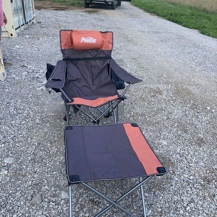 Collapsible camping chair. Orange-brown. Comes with foot stool and storage bag!