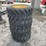 set-of-4-unused-forerunner-12-16.5n.h.s.-skid-steer-wheels-and-tires-image-4