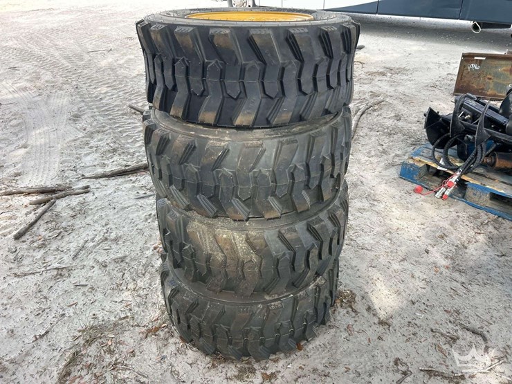 set-of-4-unused-forerunner-12-16.5n.h.s.-skid-steer-wheels-and-tires-image-2
