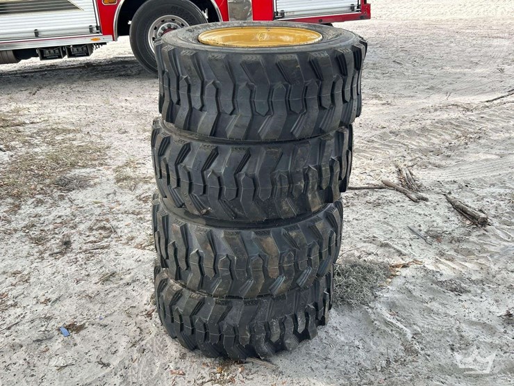 set-of-4-unused-forerunner-12-16.5n.h.s.-skid-steer-wheels-and-tires-image-1