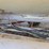 12-ton-adams-fertilizer-tender-on-running-gear,-used-last-fall,-hyd.-drive-controls,-2-compartments,-roll-tarp-image-8