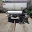 12-ton-adams-fertilizer-tender-on-running-gear,-used-last-fall,-hyd.-drive-controls,-2-compartments,-roll-tarp-image-2
