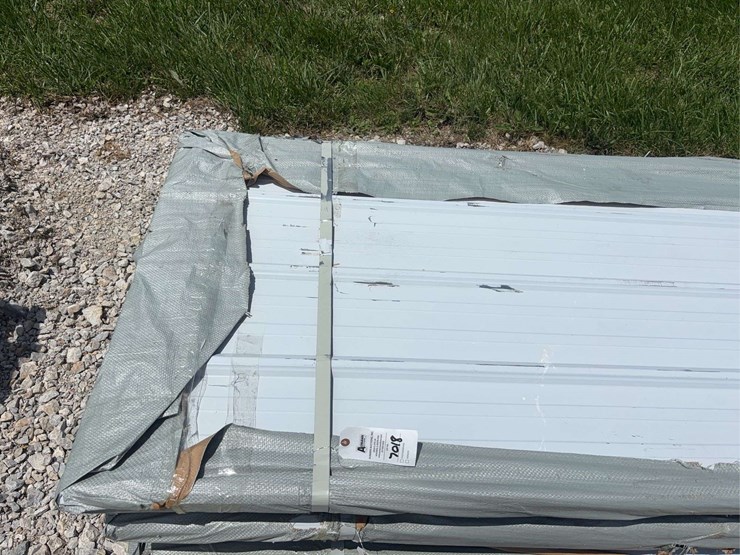 bundle-of-white-metal-roofing-panels-image-2
