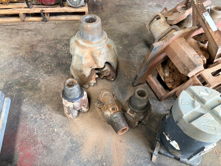 (7)-assorted-tricone-drill-bits-w/-bit-breaker-image-1