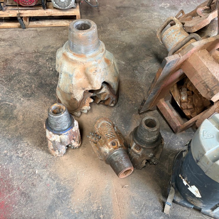(7) assorted tricone drill bits w/ bit breaker