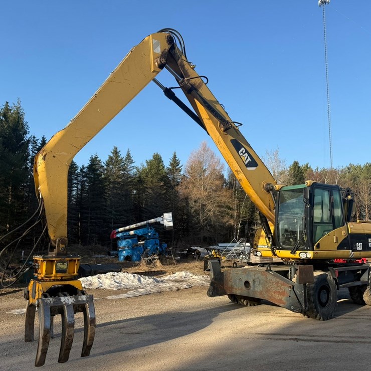 #1298 • Caterpillar M318D Material Handler