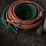wheeled-battery-charger-and-assorted-garden-hoses-image-5