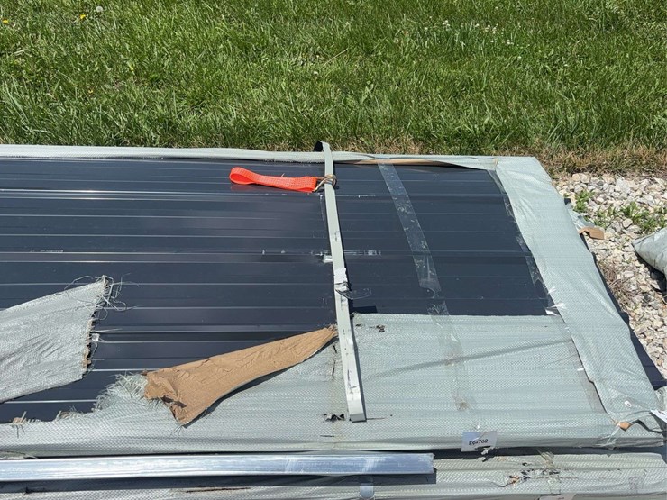 stack-of-black-corrugated-metal-roofing-panels-image-5