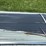 stack-of-black-corrugated-metal-roofing-panels-image-3