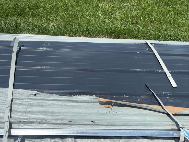 stack-of-black-corrugated-metal-roofing-panels-image-3