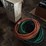 wheeled-battery-charger-and-assorted-garden-hoses-image-1