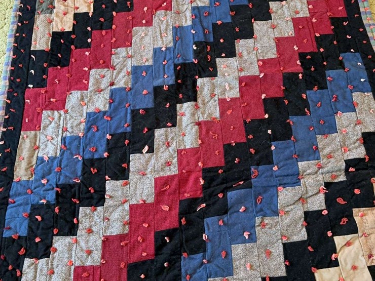 hand-tied-patchwork-quilt-with-multi-colored-fabric-blocks-image-1