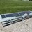 stack-of-black-corrugated-metal-roofing-panels-image-1