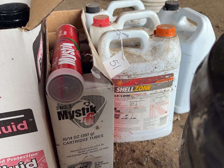 assorted-automotive-and-agricultural-lubricants,-fluids,-and-grease-cartridges-image-6