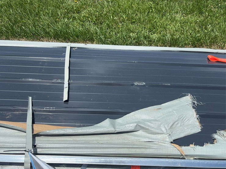 stack-of-black-corrugated-metal-roofing-panels-image-4