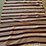 striped-woven-textile-blanket-with-fringed-edges-image-1