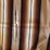 striped-woven-textile-blanket-with-fringed-edges-image-4