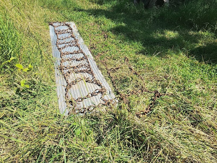 (1)-pair-of-tire-chains-off-of-14.9-38-tires-image-1