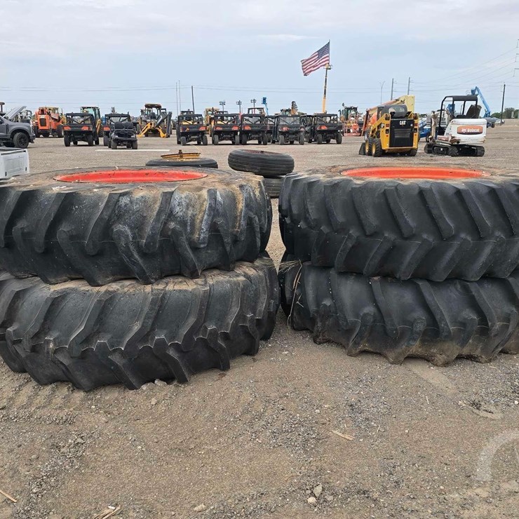 QTY. (4) TRACTOR TIRES WITH RIMS.