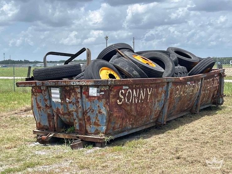 dumpster-with-tires-image-1