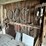 #2322-•-wall-section-of-vintage-farm-tools-image-1