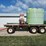 spray-wagon-on-unverferth-mccurdy-g12-running-gear-with-native-flat-rack-image-4