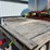 spray-wagon-on-unverferth-mccurdy-g12-running-gear-with-native-flat-rack-image-2