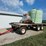 spray-wagon-on-unverferth-mccurdy-g12-running-gear-with-native-flat-rack-image-1