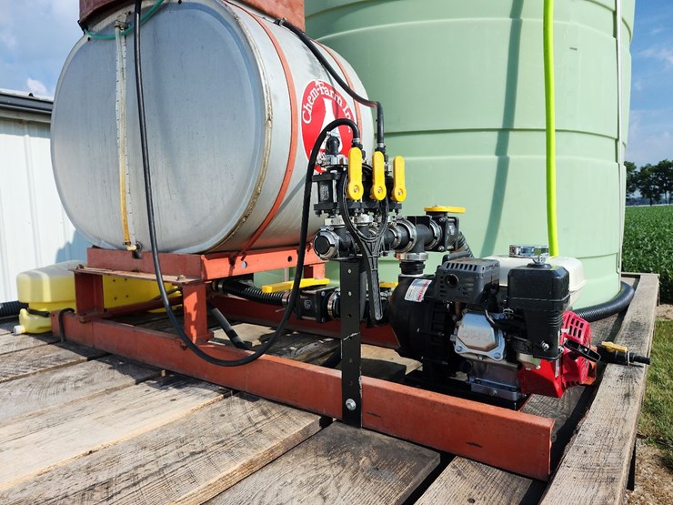spray-wagon-on-unverferth-mccurdy-g12-running-gear-with-native-flat-rack-image-23