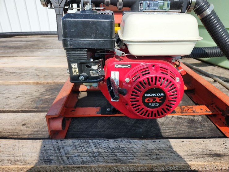 spray-wagon-on-unverferth-mccurdy-g12-running-gear-with-native-flat-rack-image-24
