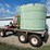spray-wagon-on-unverferth-mccurdy-g12-running-gear-with-native-flat-rack-image-11